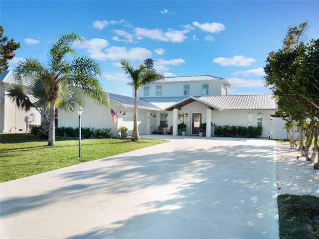 view of front of house featuring a front yard and a garage