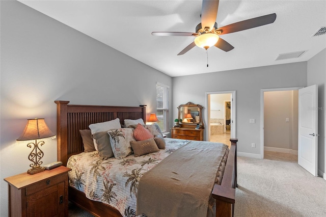 bedroom featuring connected bathroom, light colored carpet, and ceiling fan