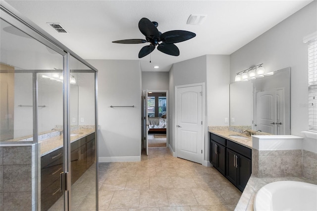 bathroom with ceiling fan, plenty of natural light, vanity, and tile patterned flooring