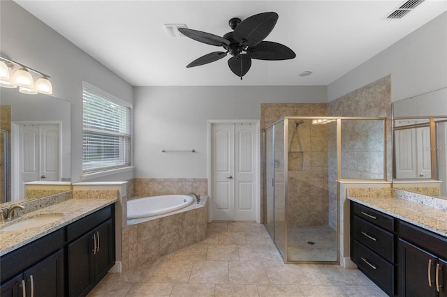 bathroom featuring tile patterned flooring, vanity, ceiling fan, and shower with separate bathtub