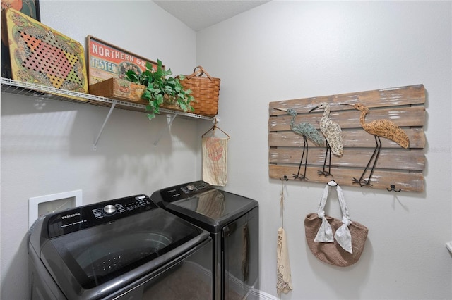 washroom featuring washing machine and clothes dryer