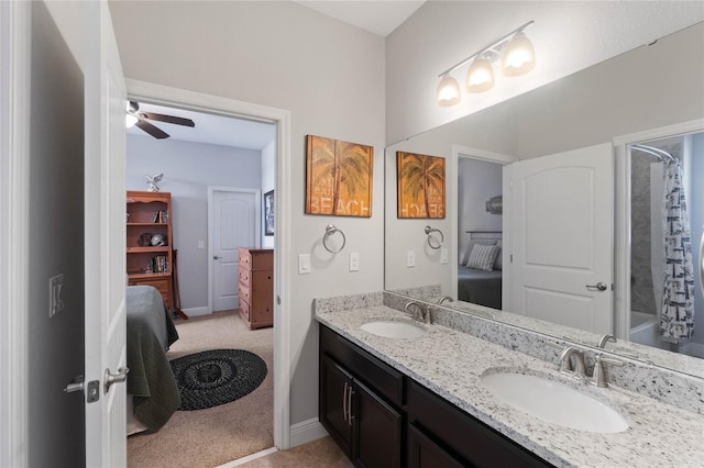 bathroom featuring ceiling fan, vanity, and  shower combination