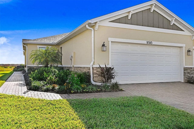 view of home's exterior featuring a yard and a garage