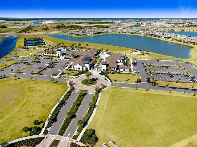 drone / aerial view with a residential view and a water view