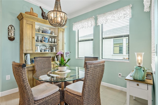 dining space featuring light tile patterned floors, baseboards, ornamental molding, and a notable chandelier