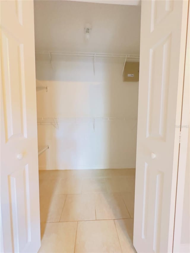 walk in closet featuring light tile patterned floors