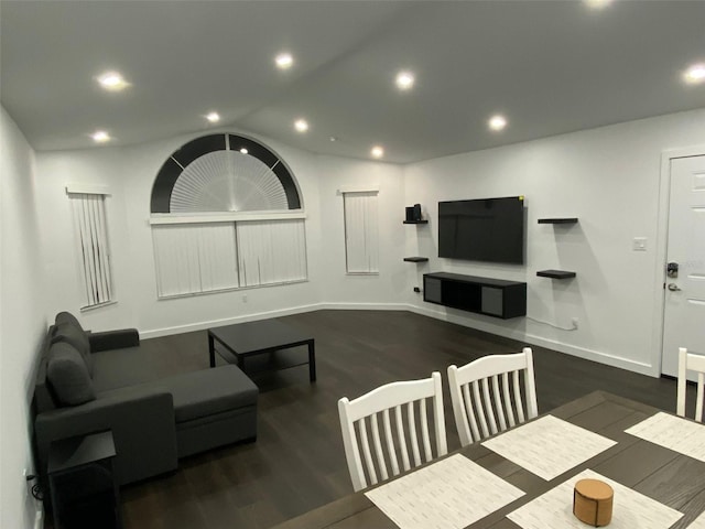 living room with dark hardwood / wood-style flooring