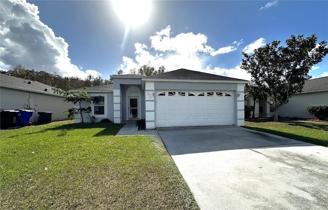 single story home with a front yard and a garage