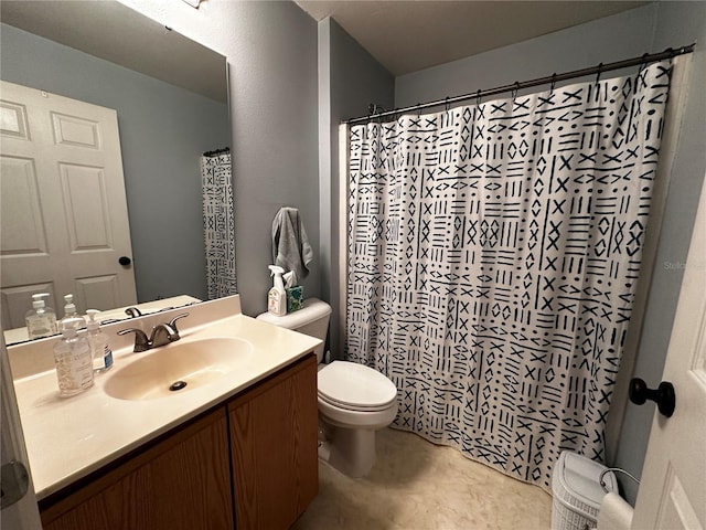 bathroom featuring vanity, toilet, and walk in shower