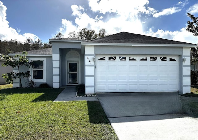 ranch-style house featuring a front yard and a garage