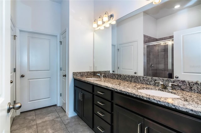 bathroom with vanity, tile patterned floors, and an enclosed shower