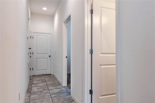 hallway featuring light tile patterned floors