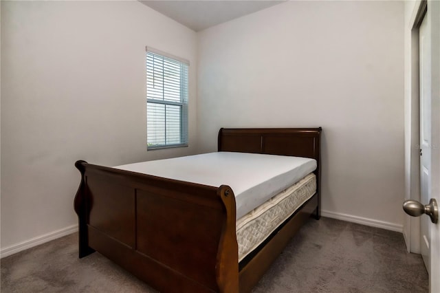 bedroom with dark colored carpet