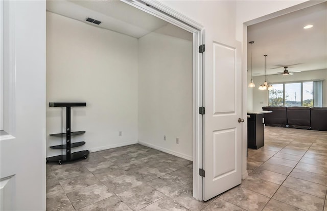 hallway with a chandelier