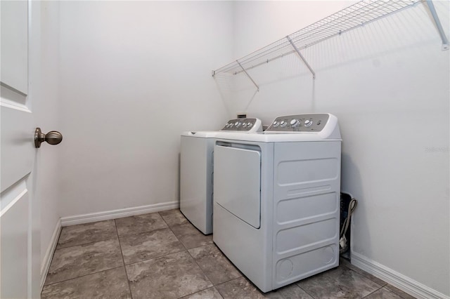 laundry room featuring washing machine and clothes dryer