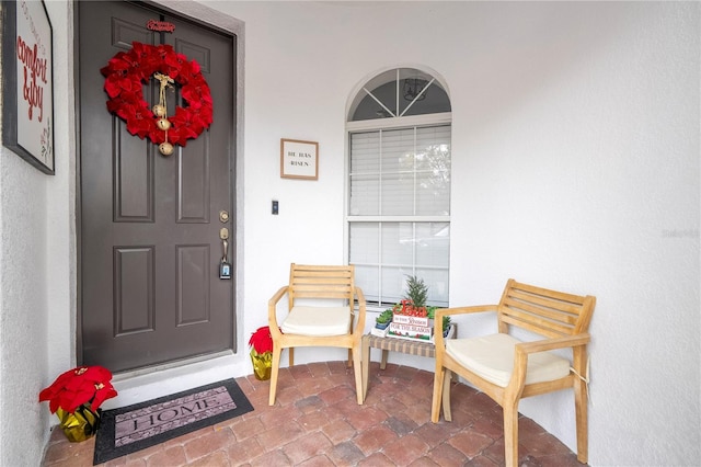 doorway to property featuring a porch