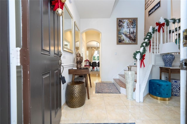 entryway with light tile patterned flooring