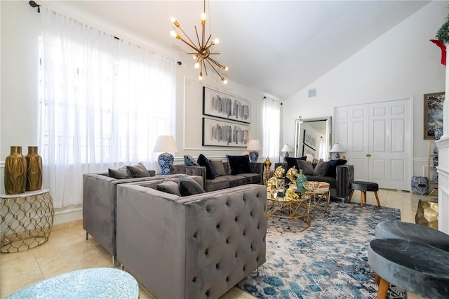 tiled living room featuring high vaulted ceiling and a chandelier