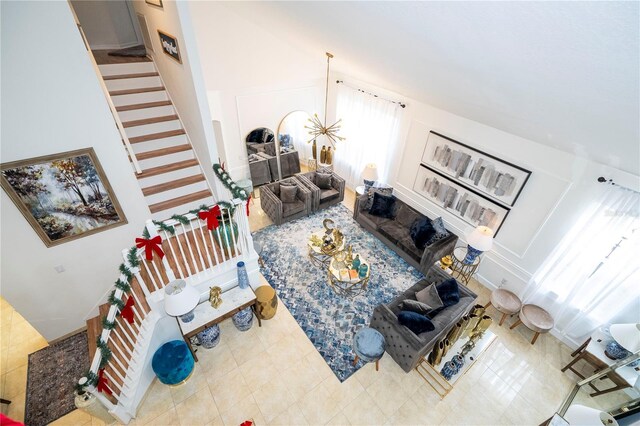 11410 Rapallo Ln, Windermere, FL 34786 - living room featuring tile patterned floors, stairs, and a high ceiling