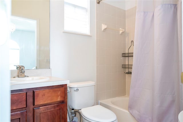 full bathroom featuring vanity, shower / bath combo, and toilet