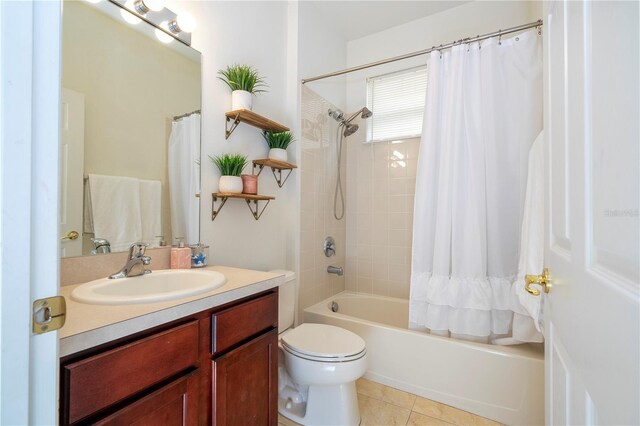 full bathroom featuring tile patterned floors, vanity, toilet, and shower / tub combo with curtain