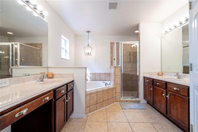 11410 Rapallo Ln, Windermere, FL 34786 - full bathroom with two vanities, a shower stall, a bath, and tile patterned flooring