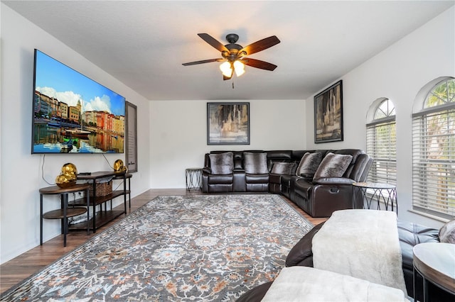 living room featuring ceiling fan and wood-type flooring