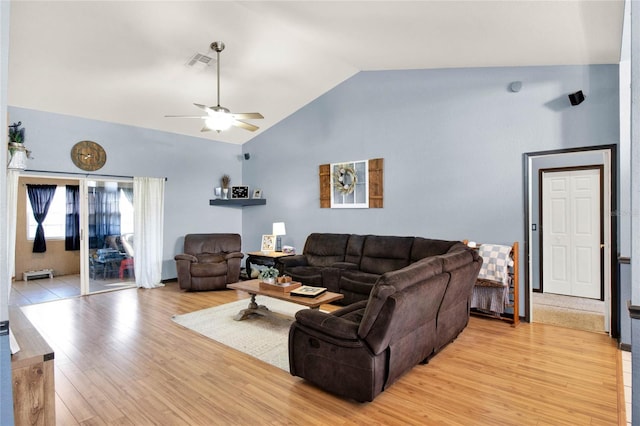 living room with high vaulted ceiling, ceiling fan, and light hardwood / wood-style flooring