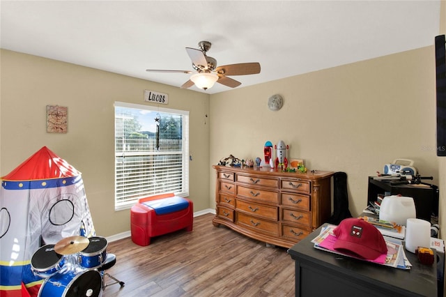 bedroom with hardwood / wood-style flooring and ceiling fan