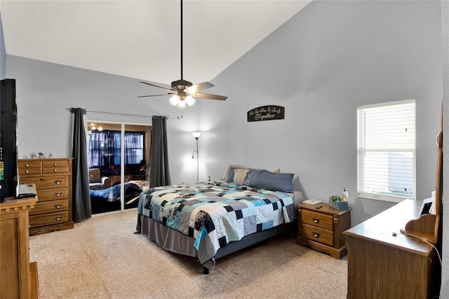 carpeted bedroom featuring ceiling fan and high vaulted ceiling