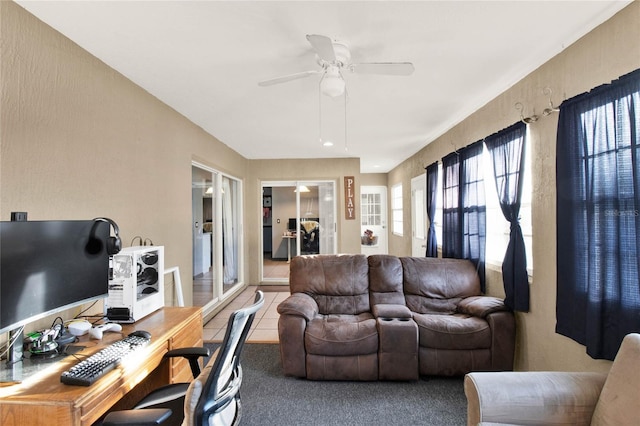 tiled living room with ceiling fan