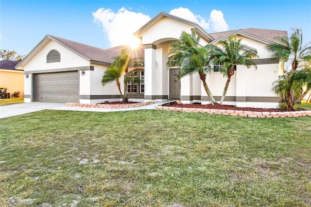 view of front of property with a garage and a front yard