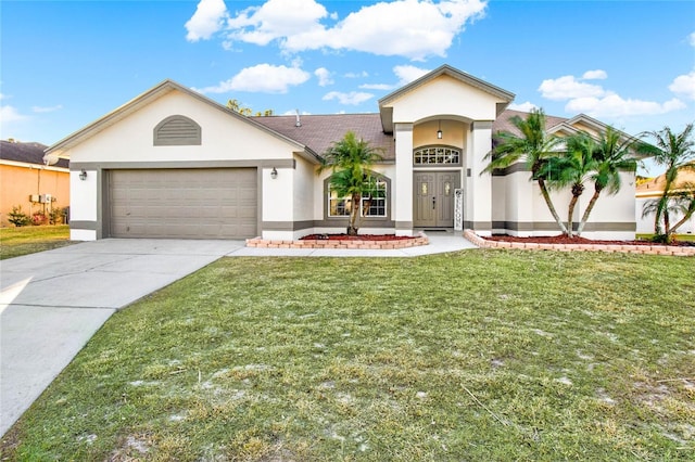 view of front of property featuring a garage and a front lawn