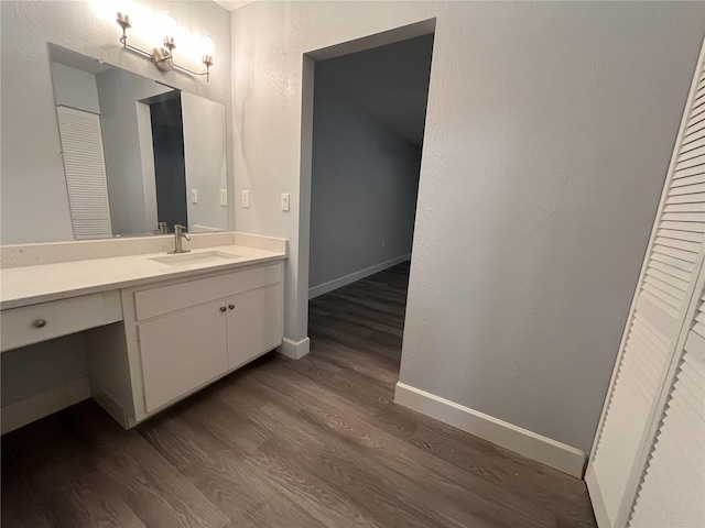 bathroom with vanity and wood-type flooring