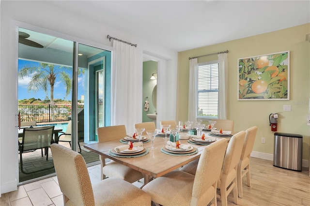 dining space with light hardwood / wood-style floors