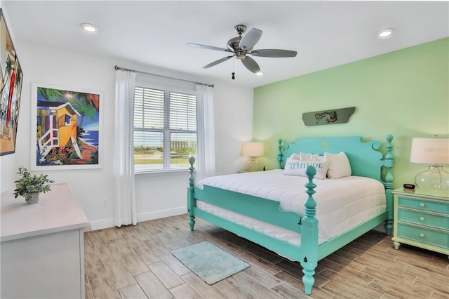 bedroom featuring ceiling fan and light hardwood / wood-style floors