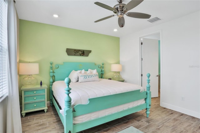 bedroom with ceiling fan and hardwood / wood-style floors