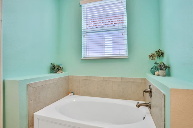 bathroom with plenty of natural light and a bath