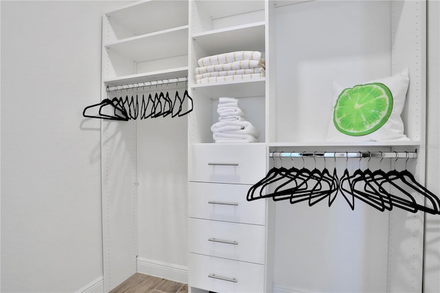 walk in closet featuring light hardwood / wood-style floors