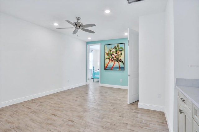 interior space with ceiling fan and light hardwood / wood-style flooring