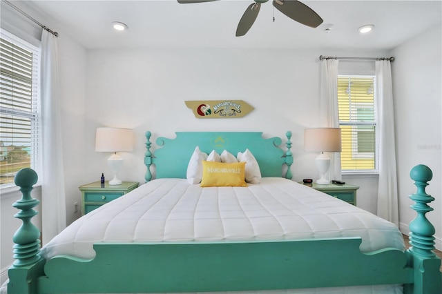 bedroom featuring multiple windows and ceiling fan