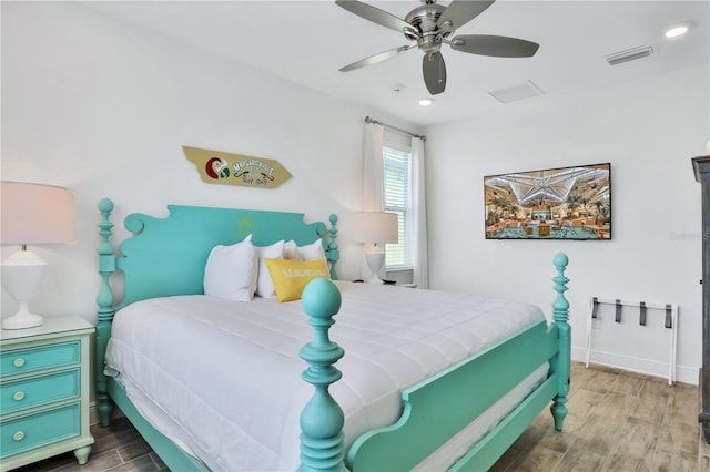 bedroom with ceiling fan and hardwood / wood-style floors