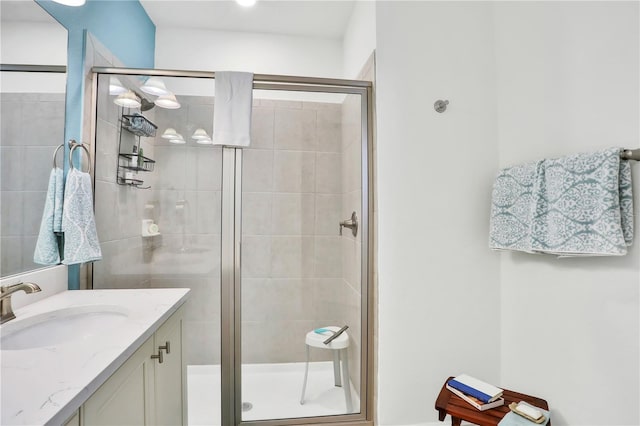 bathroom with vanity and walk in shower