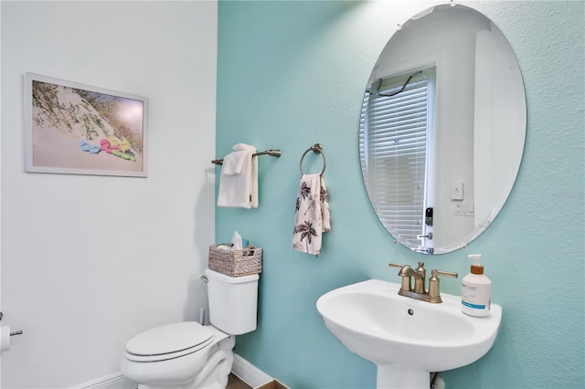 bathroom featuring sink and toilet