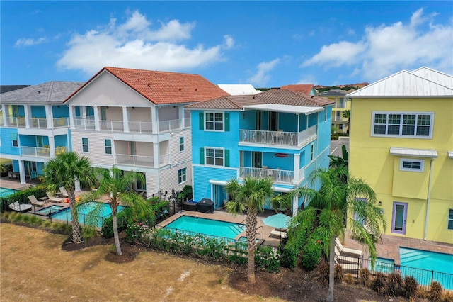 view of swimming pool featuring a patio area and grilling area