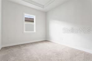 empty room featuring carpet floors