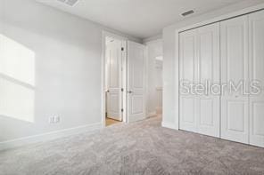 unfurnished bedroom featuring carpet floors