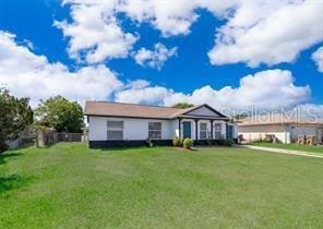 ranch-style house with a front yard