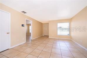 view of tiled spare room