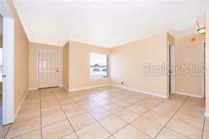 unfurnished room featuring light tile patterned floors